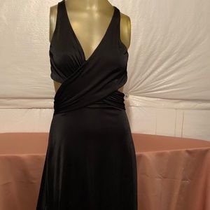 Just above the knee cut out black dress